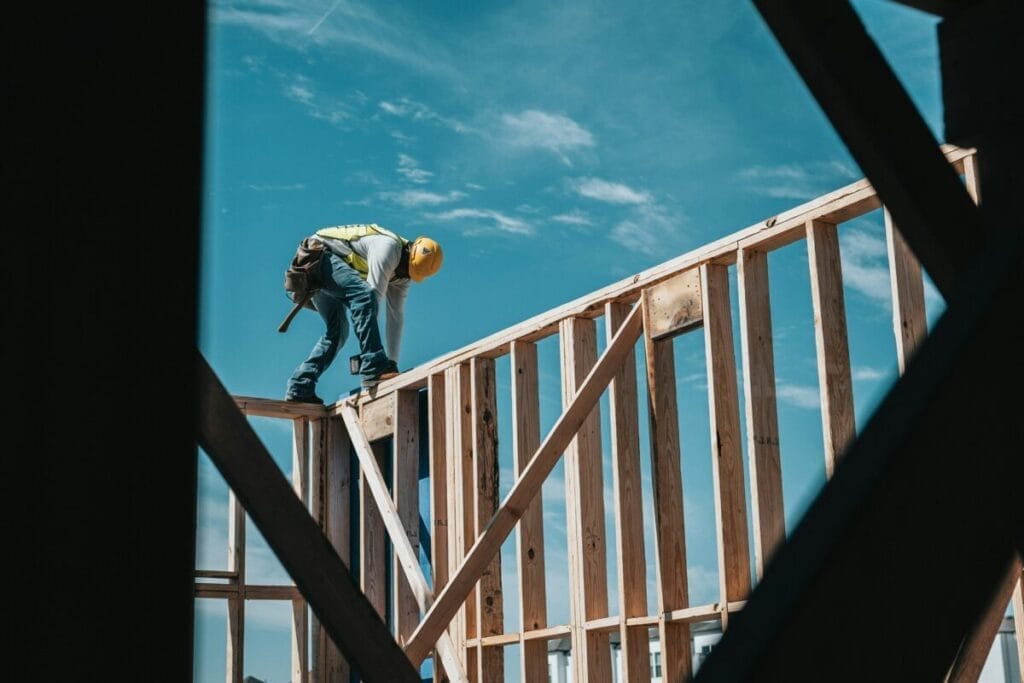 Image: construction worker building a house